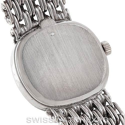 The image shows the back case and part of the bracelet of a Vintage Patek Philippe watch.