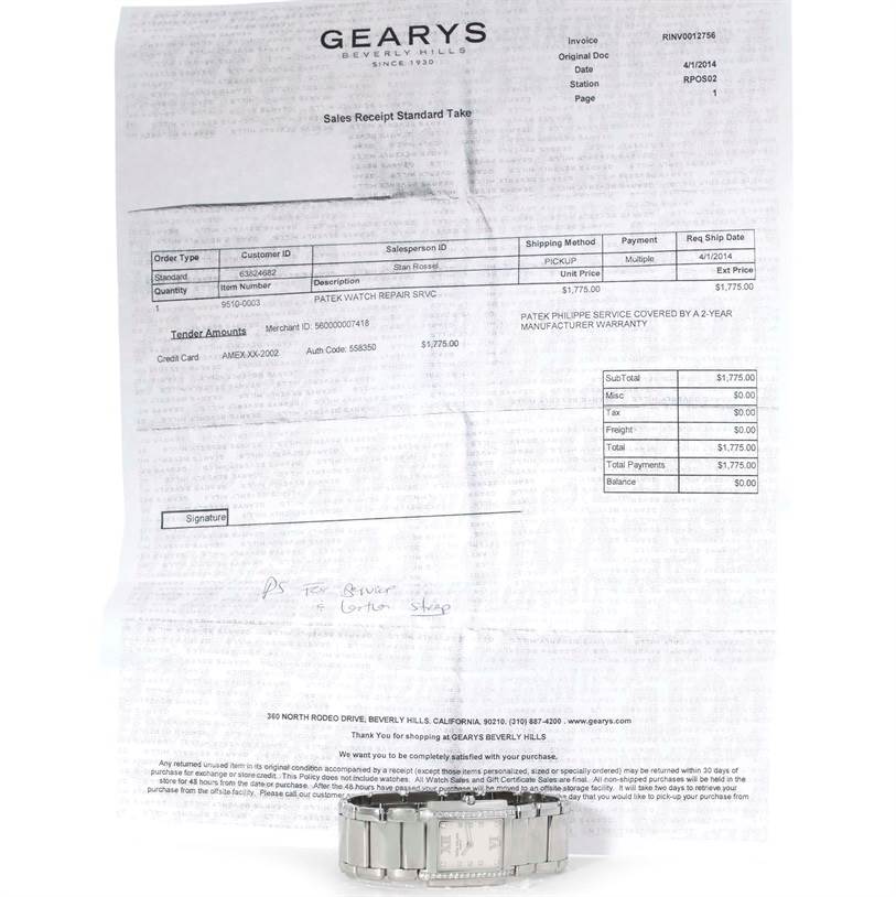 The image shows the back and bracelet of a Patek Philippe Twenty-4 4910/10A-011 Women
s Stainless Steel Silver Dial 4910/10A-011 Women
s Stainless Steel Silver Dial model watch placed in front of a sales receipt.