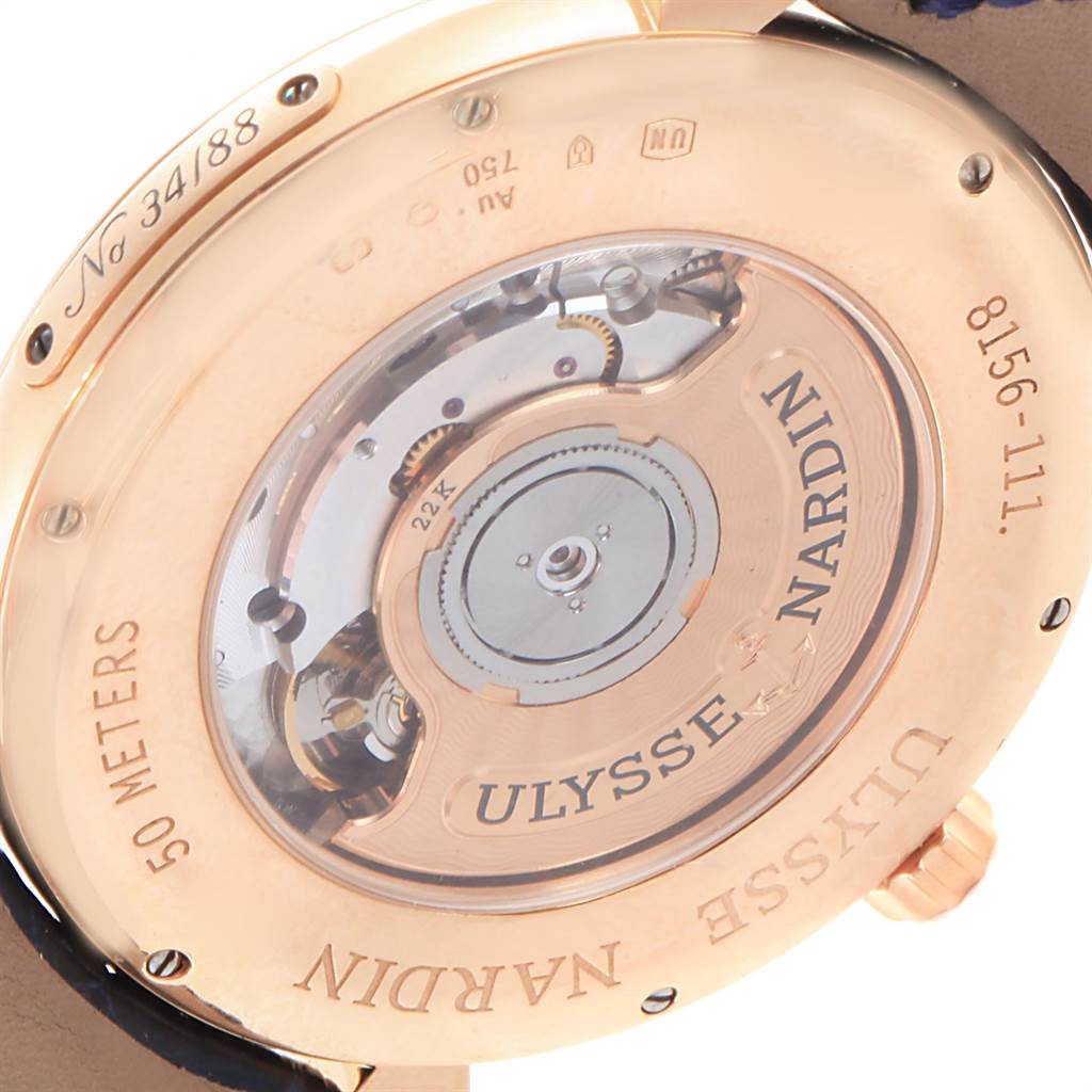 This image shows the back view of the Ulysse Nardin Classico 8156-111-B-2 Men
s Rose Gold Blue Dial 8156-111-B-2 Men
s Rose Gold Blue Dial watch, highlighting its transparent case back and visible movement.