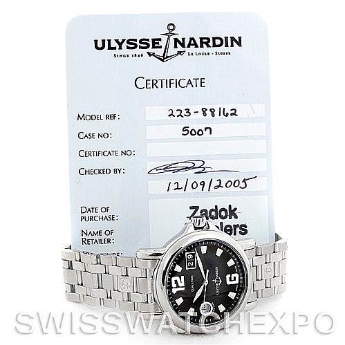 The image shows an Ulysse Nardin 2238862 Men
s Stainless Steel Black Dial 2238862 Men
s Stainless Steel Black Dial Dual Time Big Date Men
s Watch 2238862 model at a frontal angle with its certificate in the background.