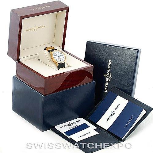 The image shows a Ulysse Nardin Marine 261-77-3 Men's Yellow Gold Silver Dial 261-77-3 Men's Yellow Gold Silver Dial model watch angled slightly to the right, with its box, warranty, and documentation displayed.