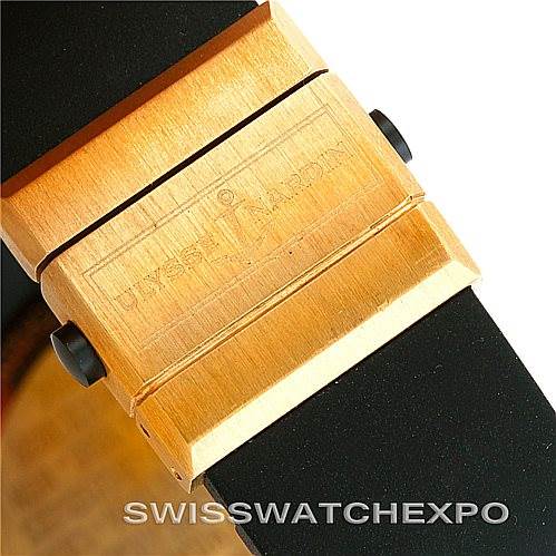 The image shows a close-up of the clasp of a Ulysse Nardin Marine 261-77-3 Men's Yellow Gold Silver Dial 261-77-3 Men's Yellow Gold Silver Dial model watch, highlighting its engraved branding.