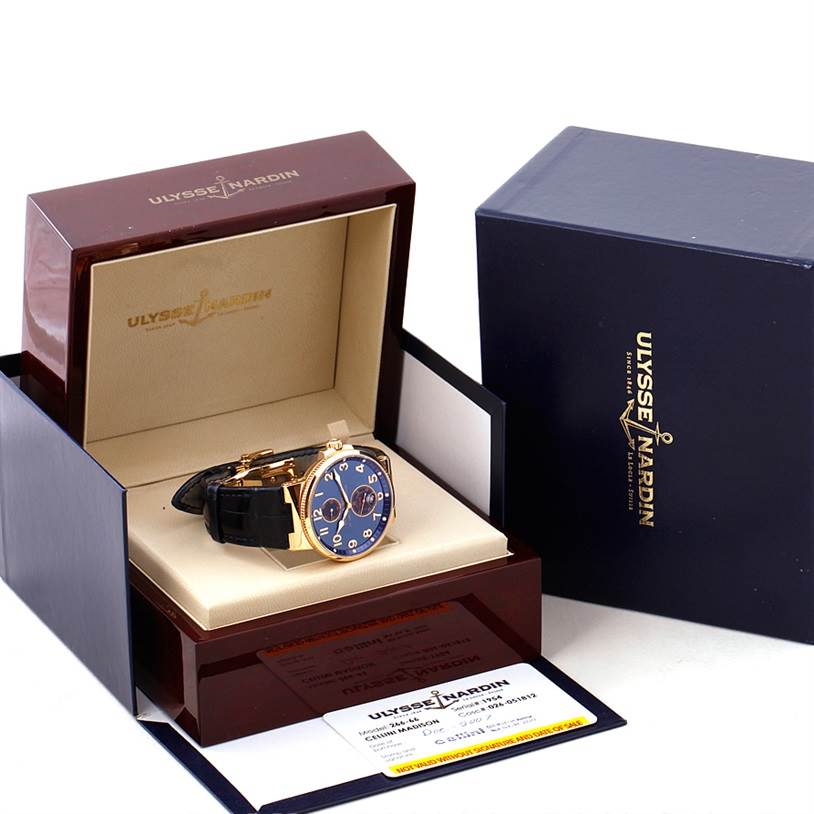 The image shows a Ulysse Nardin Marine 266-66 Men's Rose Gold Blue Dial 266-66 Men's Rose Gold Blue Dial model watch at an angle, inside its presentation box with related accessories.