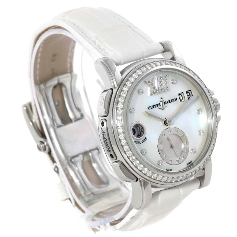 The image shows a close-up, angled view of the Ulysse Nardin 243-22B Women's Stainless Steel Mother of Pearl Dial 243-22B Women's Stainless Steel Mother of Pearl Dial Big Date GMT Ladies Steel Watch 243-22B, highlighting the dial and part of the strap.