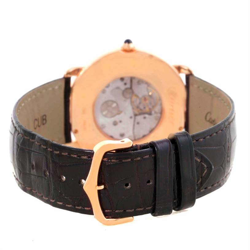 This image displays the Cartier Ronde W6800251 Men
s Rose Gold Silver Dial W6800251 Men
s Rose Gold Silver Dial model watch from the rear, highlighting its inner mechanism and leather strap with buckle.