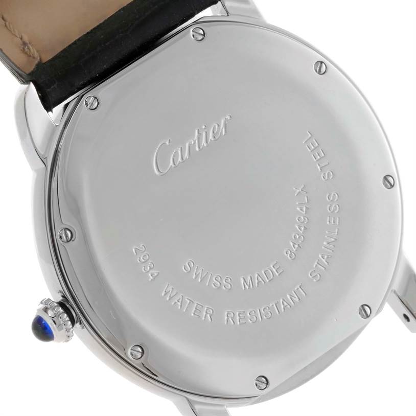 The image shows the back case of the Cartier Ronde W6700255 Men's Stainless Steel Silver Dial W6700255 Men's Stainless Steel Silver Dial watch, featuring its engravings and the crown with a blue gemstone.