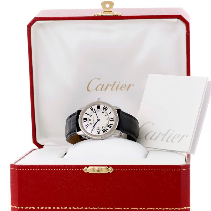 The Cartier Ronde W6700255 Men's Stainless Steel Silver Dial W6700255 Men's Stainless Steel Silver Dial watch is shown from the front inside its red box, accompanied by documents.