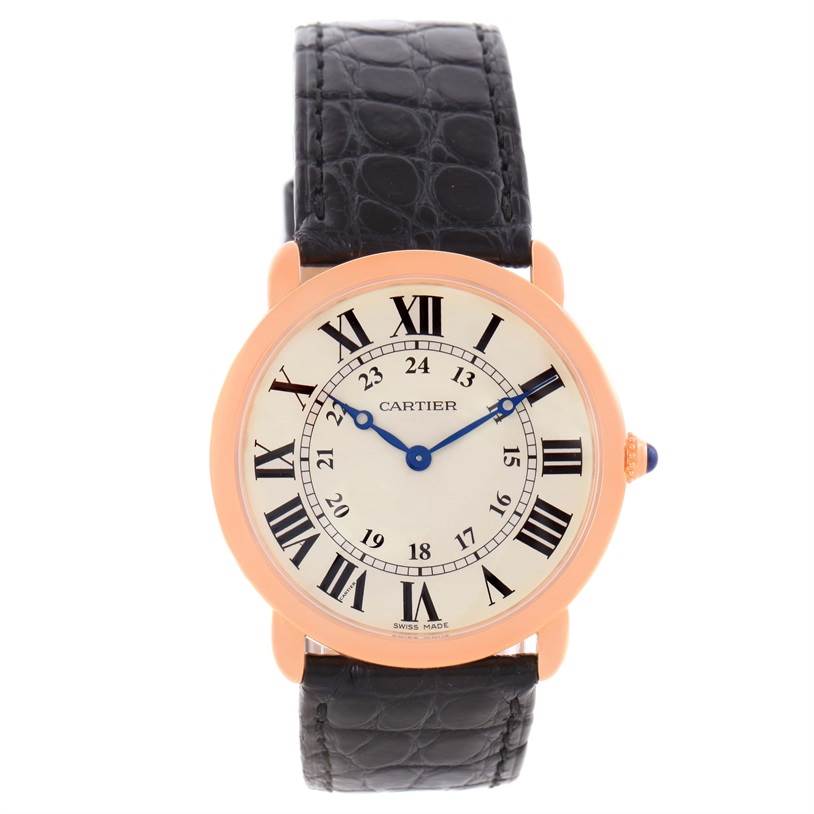The Ronde model by Cartier is shown from a front angle, featuring its face, gold bezel, and black textured leather strap.