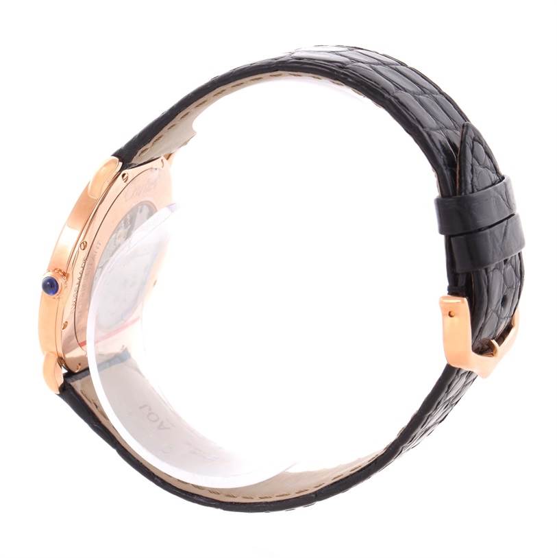 This image shows the Ronde model by Cartier from a side angle, highlighting its black strap and rose gold case.