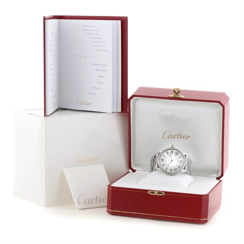 The image shows a Cartier Ronde W6701011 Men's Stainless Steel Silver Dial W6701011 Men's Stainless Steel Silver Dial model watch displayed in an open red box with accompanying documentation and packaging.