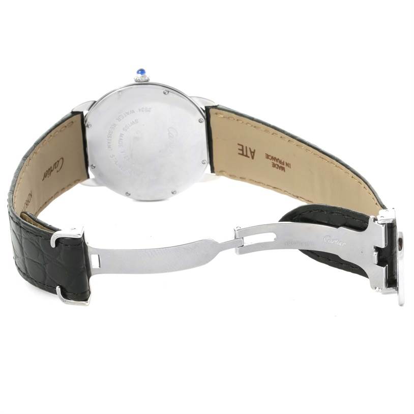 The image shows the back view of the Ronde model by Cartier, highlighting its open leather strap and clasp.