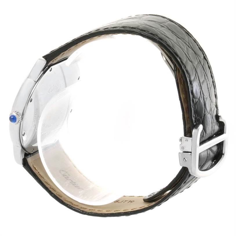 This image shows the side and back view of a Cartier Ronde W6700255 Stainless Steel Silver Dial W6700255 Stainless Steel Silver Dial watch with a black leather strap and a blue cabochon crown.