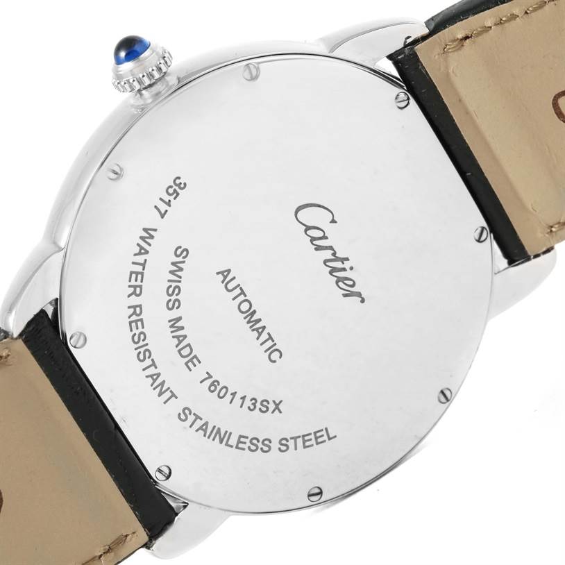 The image shows the back case of a Cartier Ronde W6701010 Men
s Stainless Steel Silver Dial W6701010 Men
s Stainless Steel Silver Dial model watch, including part of the leather strap and crown with a blue cabochon.