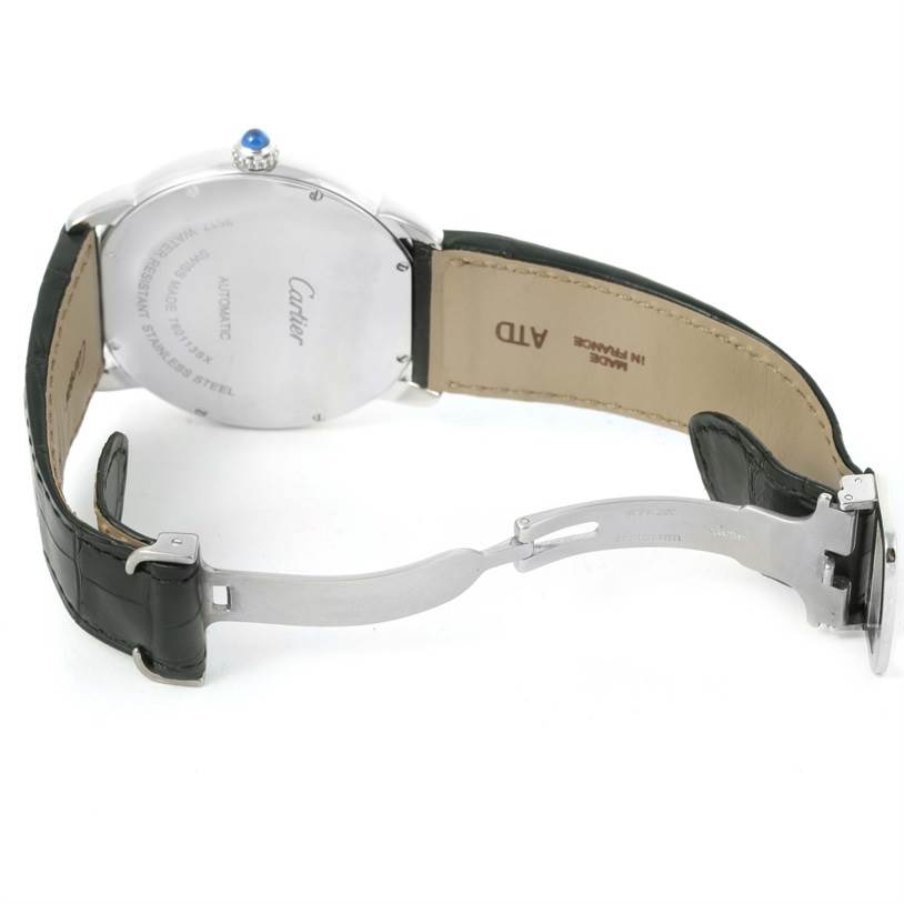 The image shows the back of a Ronde model by Cartier, highlighting the case back, crown, and partially open leather strap and clasp.