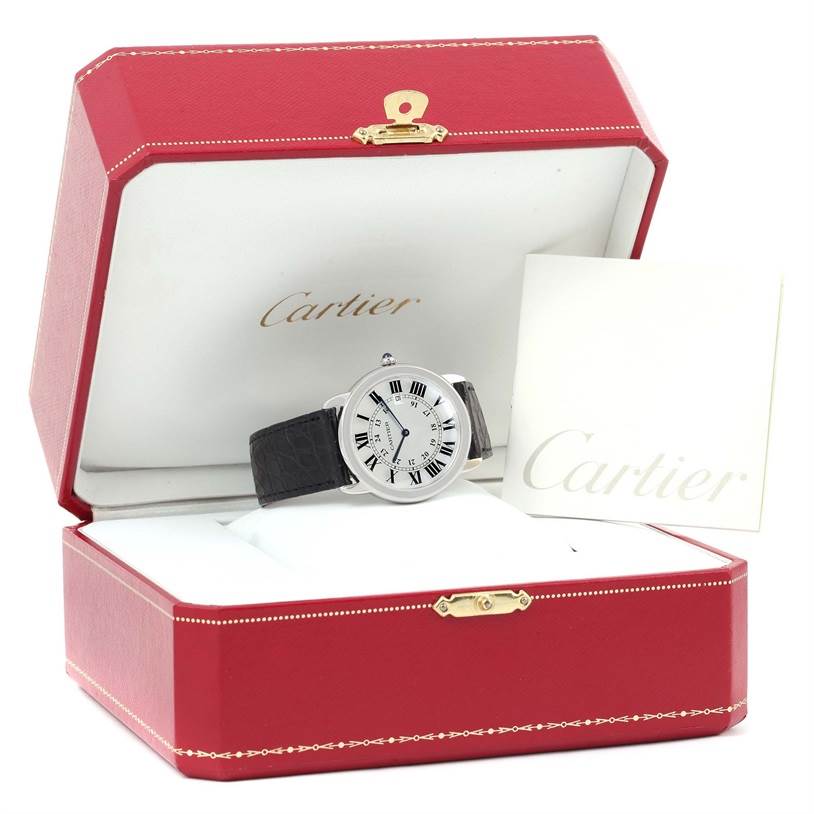 The Cartier Ronde W6700255 Stainless Steel Silver Dial W6700255 Stainless Steel Silver Dial watch is displayed front-facing in an open red box with a Cartier booklet beside it.