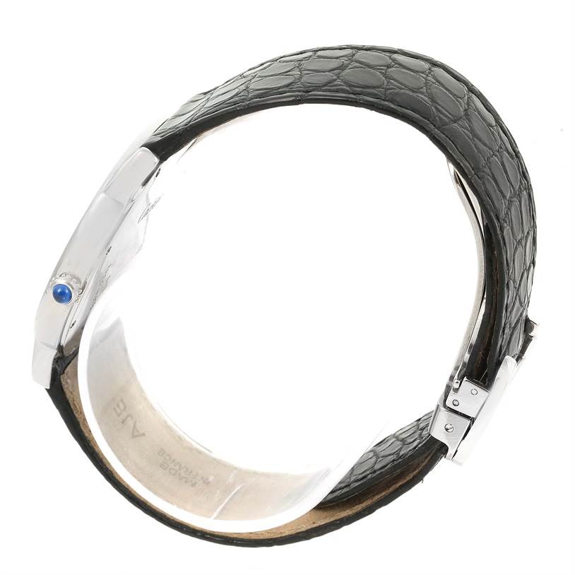 The image shows a side view of a Cartier Ronde W6700255 Stainless Steel Silver Dial W6700255 Stainless Steel Silver Dial watch, highlighting its black leather strap and metal case with a blue crown.