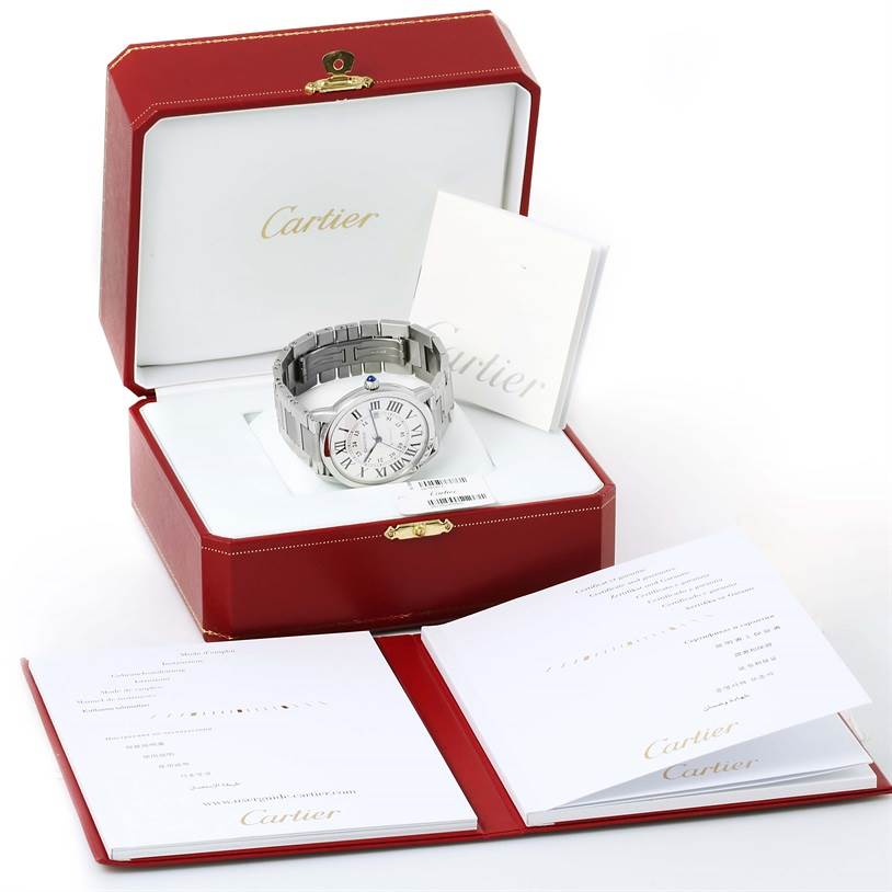 The Cartier Ronde W6701011 Men's Stainless Steel Silver Dial W6701011 Men's Stainless Steel Silver Dial watch is displayed in an open red box with accompanying paperwork and booklets.