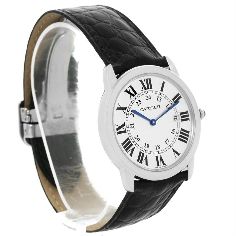 The image shows the Cartier Ronde W6700255 Stainless Steel Silver Dial W6700255 Stainless Steel Silver Dial model watch from a side angle, featuring its black leather strap and round white dial with Roman numerals.