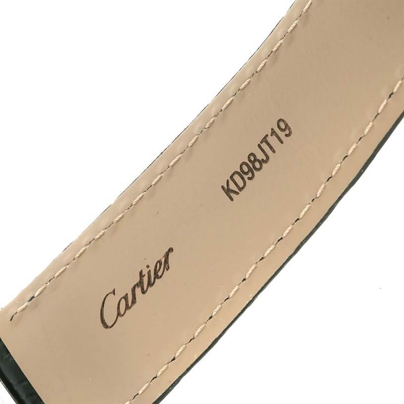 This image shows a close-up of the backside of a Ronde model Cartier watch strap, featuring stitching and branding.