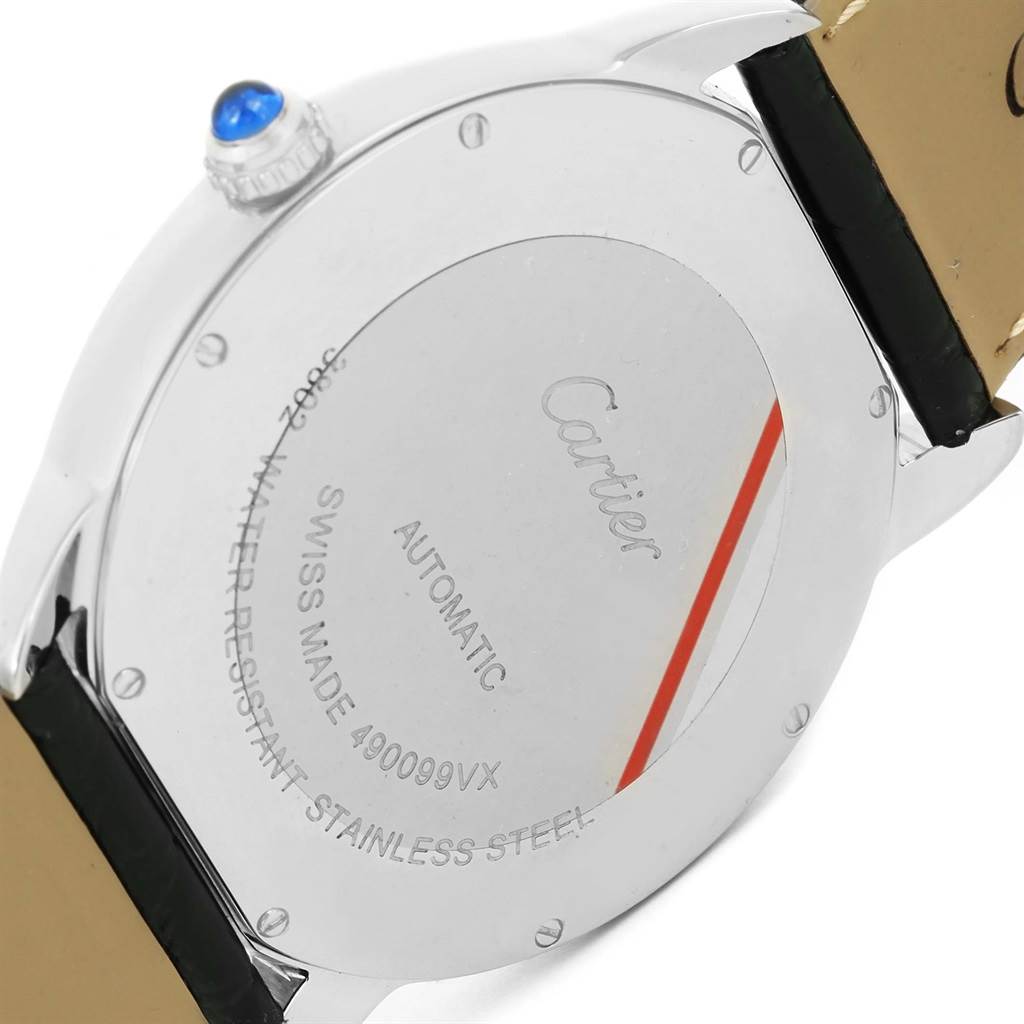 This image shows the back case of a Cartier Ronde W6701010 Men
s Stainless Steel Silver Dial W6701010 Men
s Stainless Steel Silver Dial watch, highlighting the engravings and crown with a blue stone.