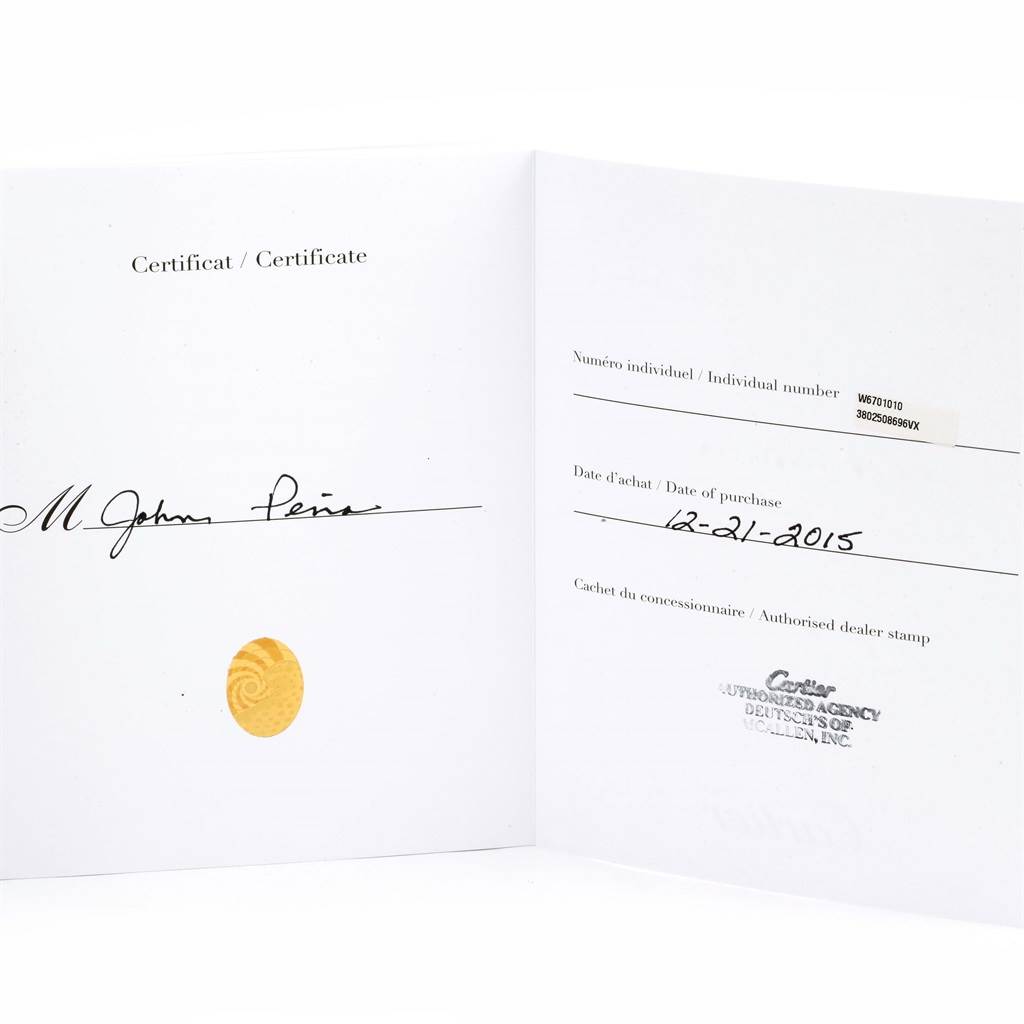 This is an open warranty certificate for the Cartier Ronde W6701010 Men's Stainless Steel Silver Dial W6701010 Men's Stainless Steel Silver Dial model, featuring a signature, date of purchase, and dealer stamp.