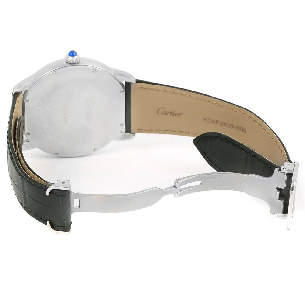 The image shows the back case, part of the strap, and the clasp of a Cartier Ronde W6701010 Men's Stainless Steel Silver Dial W6701010 Men's Stainless Steel Silver Dial model watch, featuring a visible blue stone on the crown.