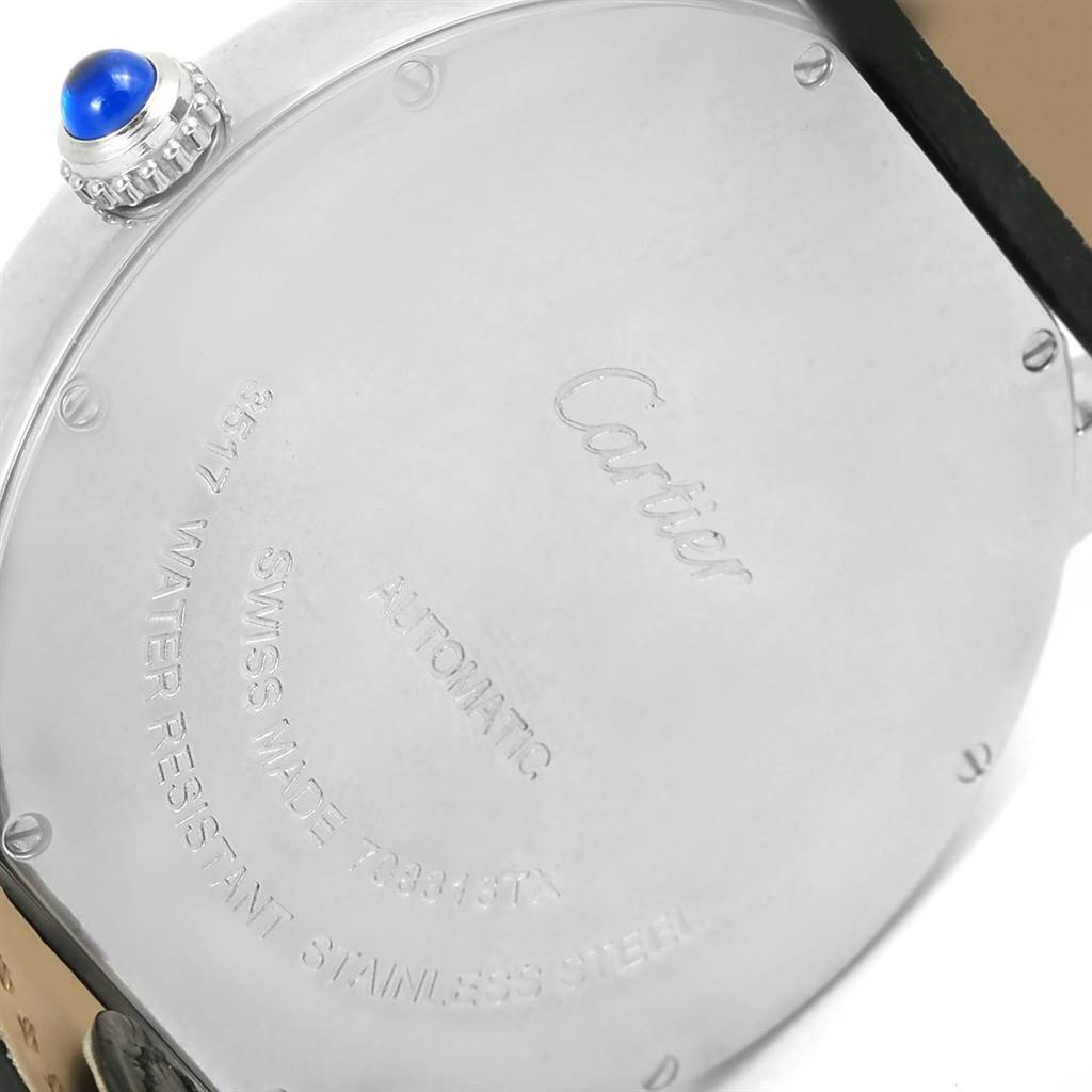 This image shows the back of a Cartier Ronde W6701010 Men's Stainless Steel Silver Dial W6701010 Men's Stainless Steel Silver Dial watch, including its case and a crown with a blue cabochon.