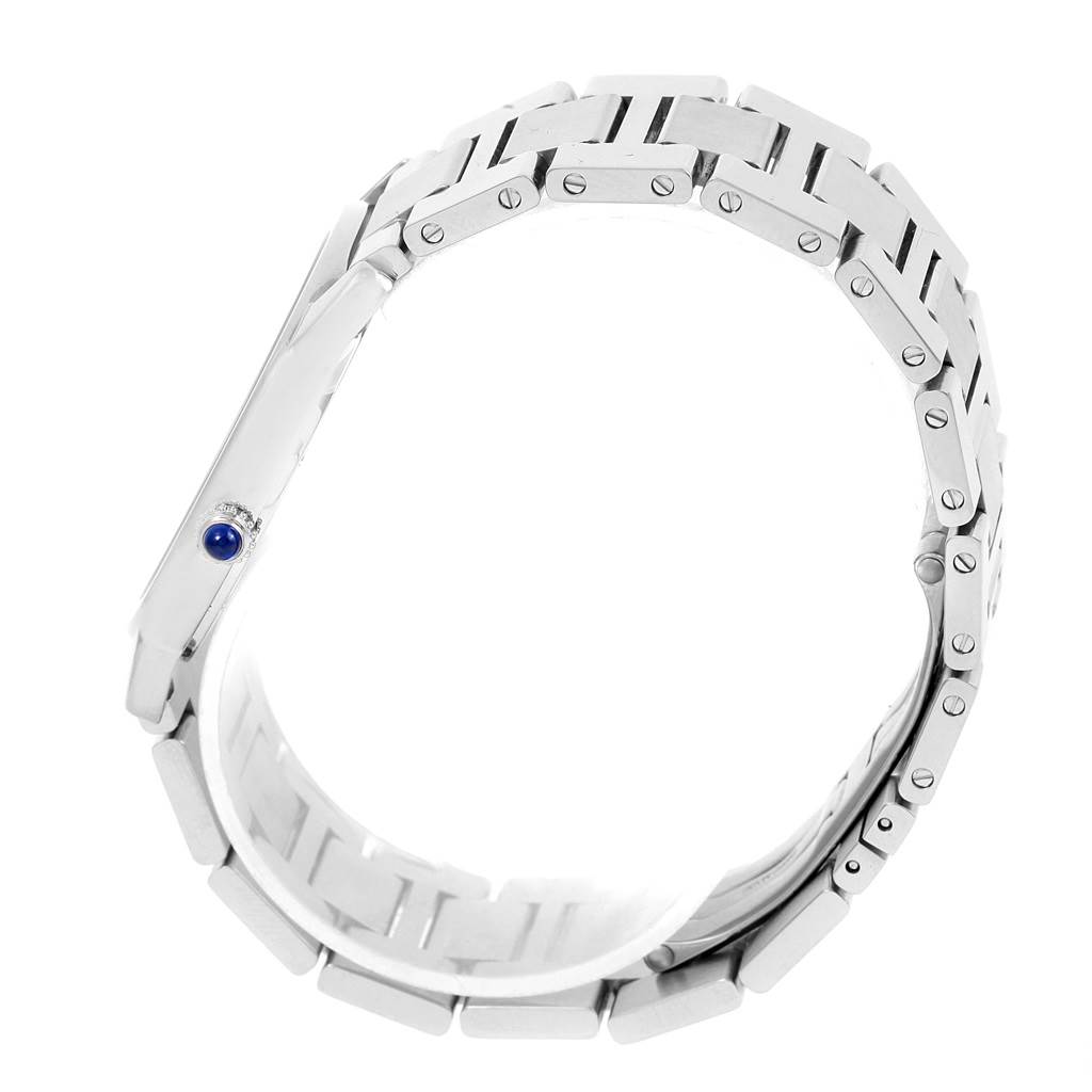 The image shows the side view of the Cartier Ronde W6701005 Men
s Stainless Steel Silver Dial W6701005 Men
s Stainless Steel Silver Dial watch, featuring its bracelet and the crown with a blue gemstone.