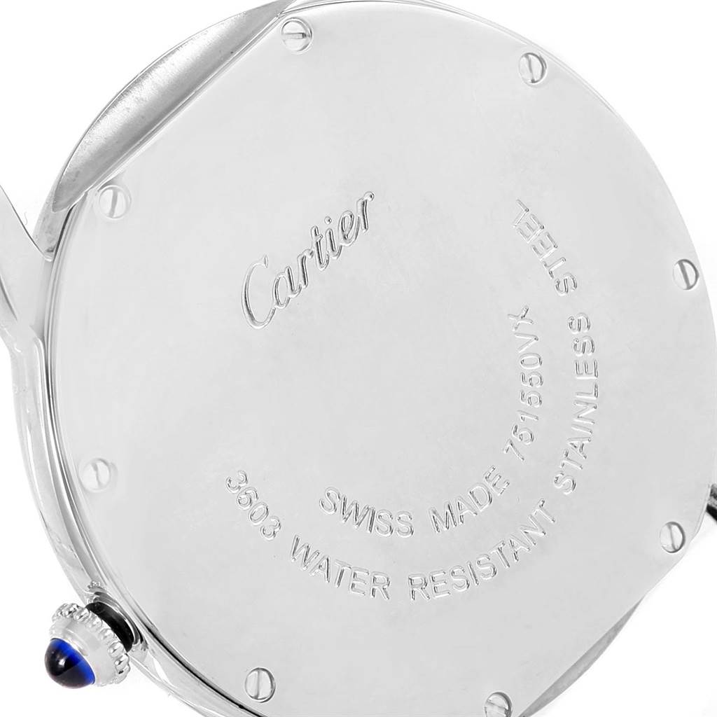 The image shows the back case of a Cartier Ronde W6701005 Men
s Stainless Steel Silver Dial W6701005 Men
s Stainless Steel Silver Dial watch, highlighting its engravings and the crown with a blue cabochon.