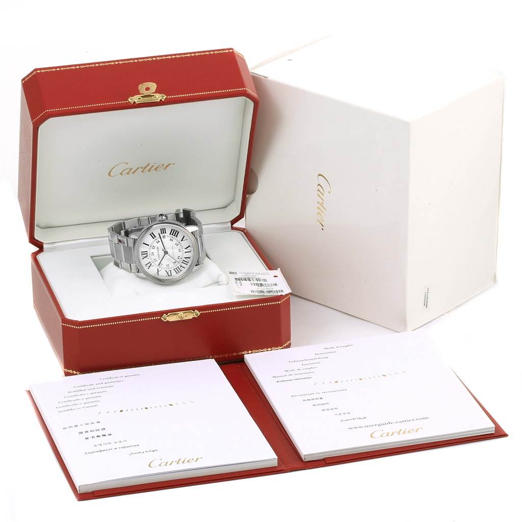 The image shows a Cartier Ronde W6701011 Men
s Stainless Steel Silver Dial W6701011 Men
s Stainless Steel Silver Dial watch in its opened box, alongside warranty booklets and outer packaging.