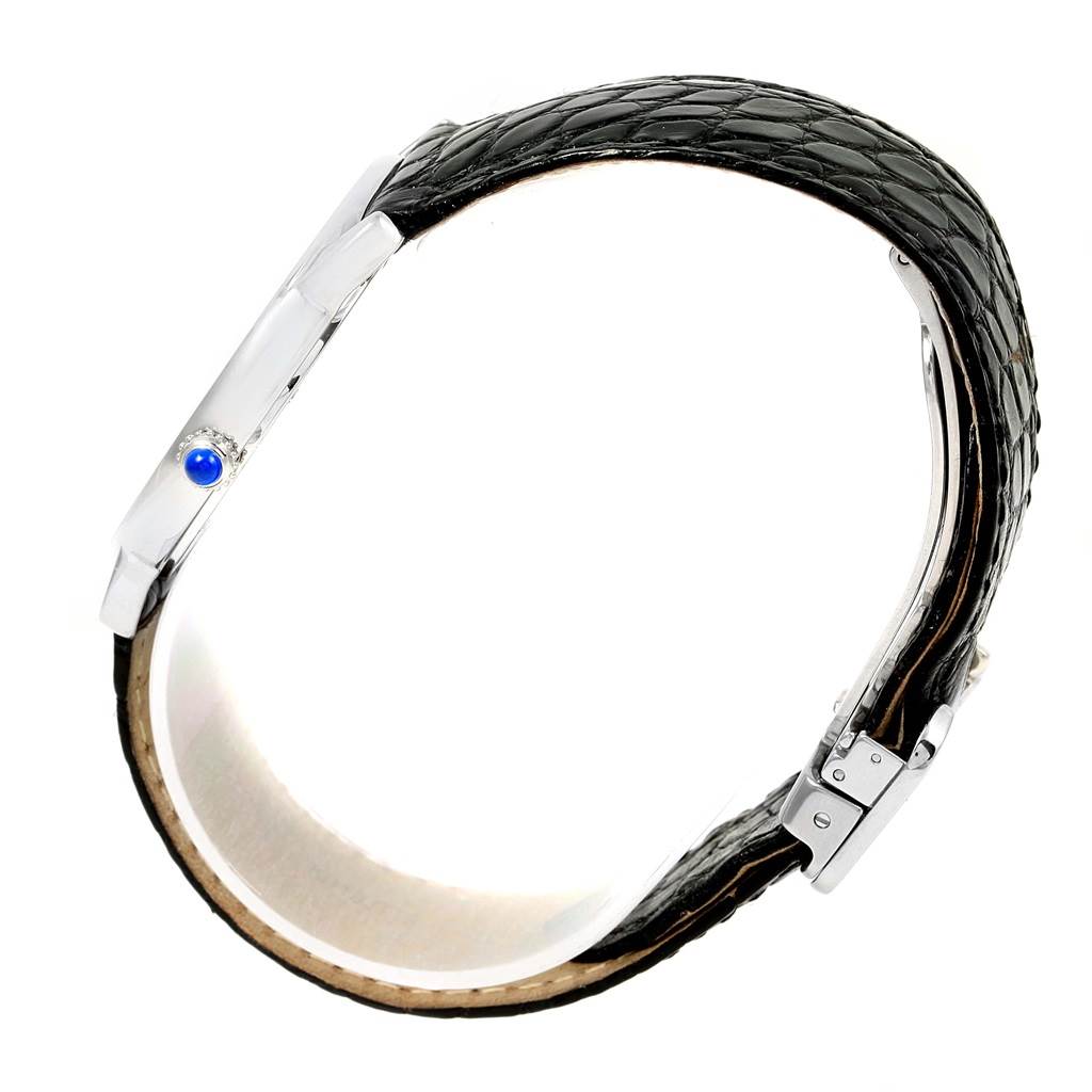 This image shows a side view of the Cartier Ronde W6700255 Stainless Steel Silver Dial W6700255 Stainless Steel Silver Dial model watch featuring the watch case, crown, and black leather strap.