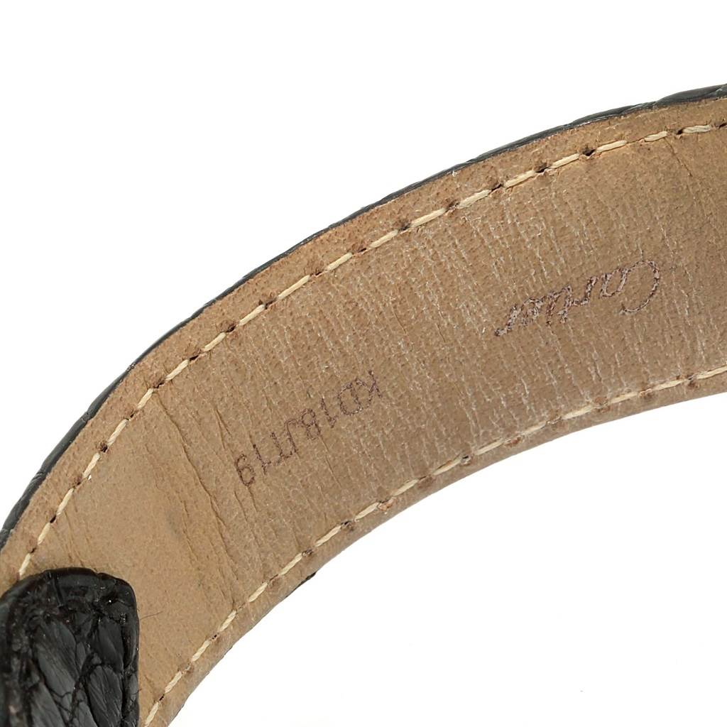 The image shows the inner part of the leather strap of a Ronde model by Cartier, displaying stitching and branding.