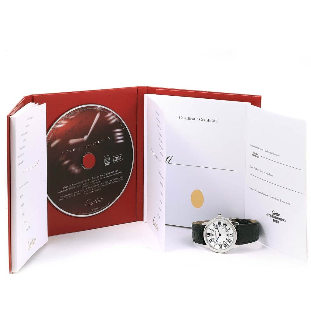 A Cartier Ronde W6700255 Stainless Steel Silver Dial W6700255 Stainless Steel Silver Dial model watch is pictured with its box, certificate, and a CD, viewed from a front angle.