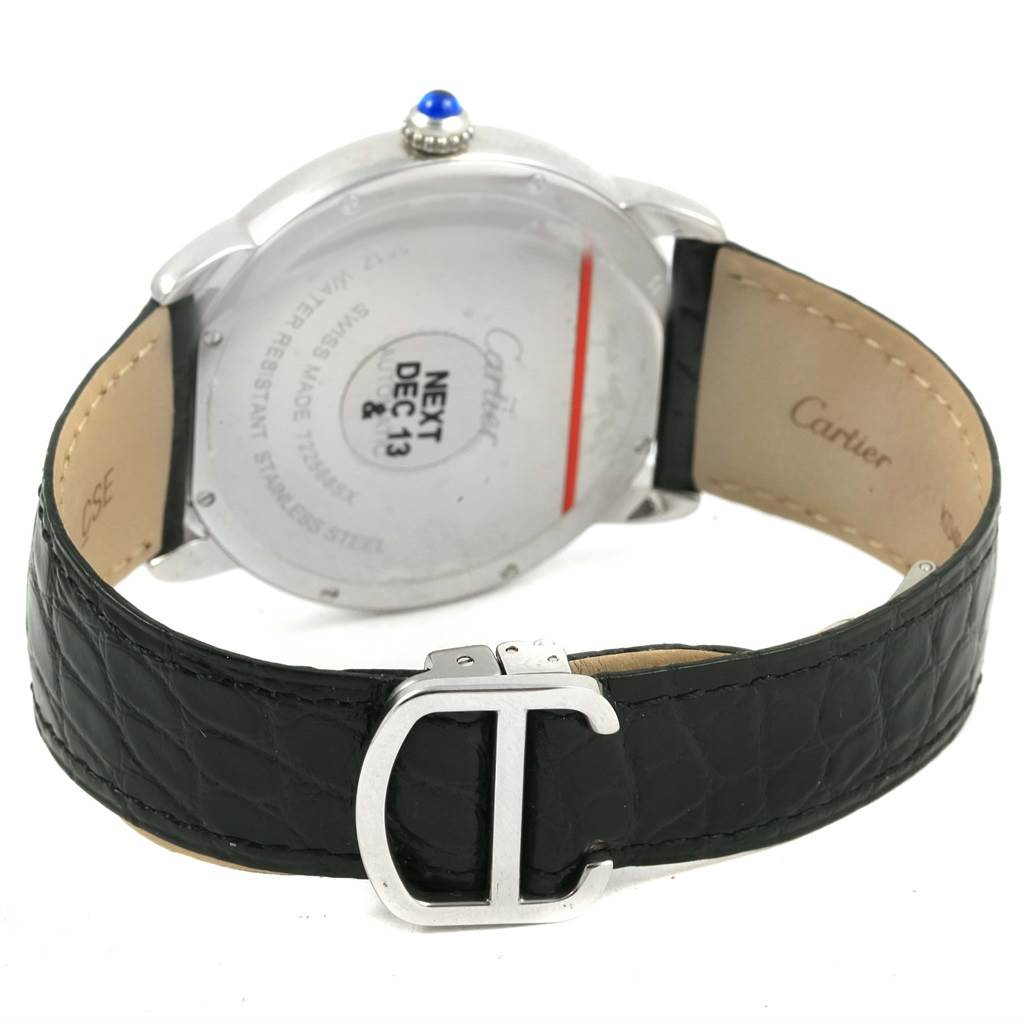 This image shows the back side of a Cartier Ronde W6701010 Men's Stainless Steel Silver Dial W6701010 Men's Stainless Steel Silver Dial watch, including the case back, crown, and black leather strap with the Cartier logo.