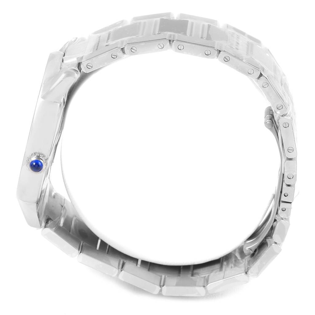 The image shows a side view of the case and bracelet of a Cartier Ronde W6701011 Men's Stainless Steel Silver Dial W6701011 Men's Stainless Steel Silver Dial watch, highlighting a blue cabochon crown.