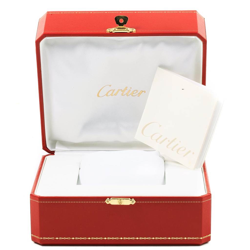 The image shows an open red and white Cartier watch box with a booklet for the Ronde model.