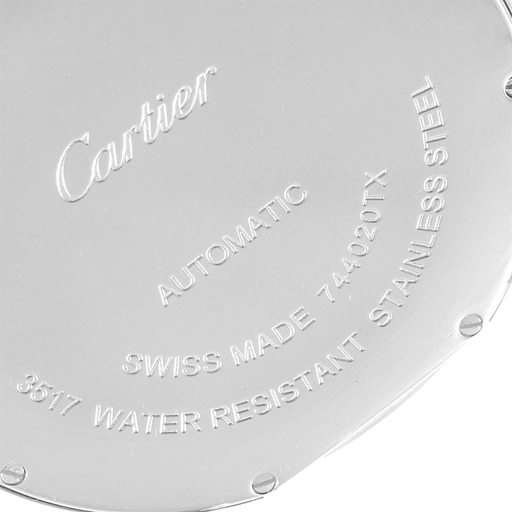 The image shows a close-up of the backside of the Ronde model watch by Cartier, featuring engraved details.