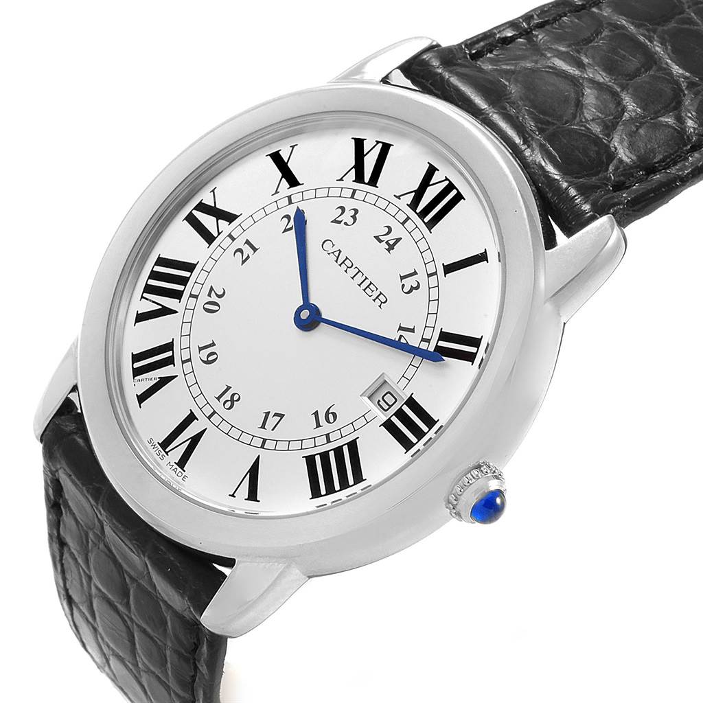 This image shows a Cartier Ronde W6700255 Stainless Steel Silver Dial W6700255 Stainless Steel Silver Dial watch at an angle highlighting its face, leather strap, and crown with a blue cabochon.