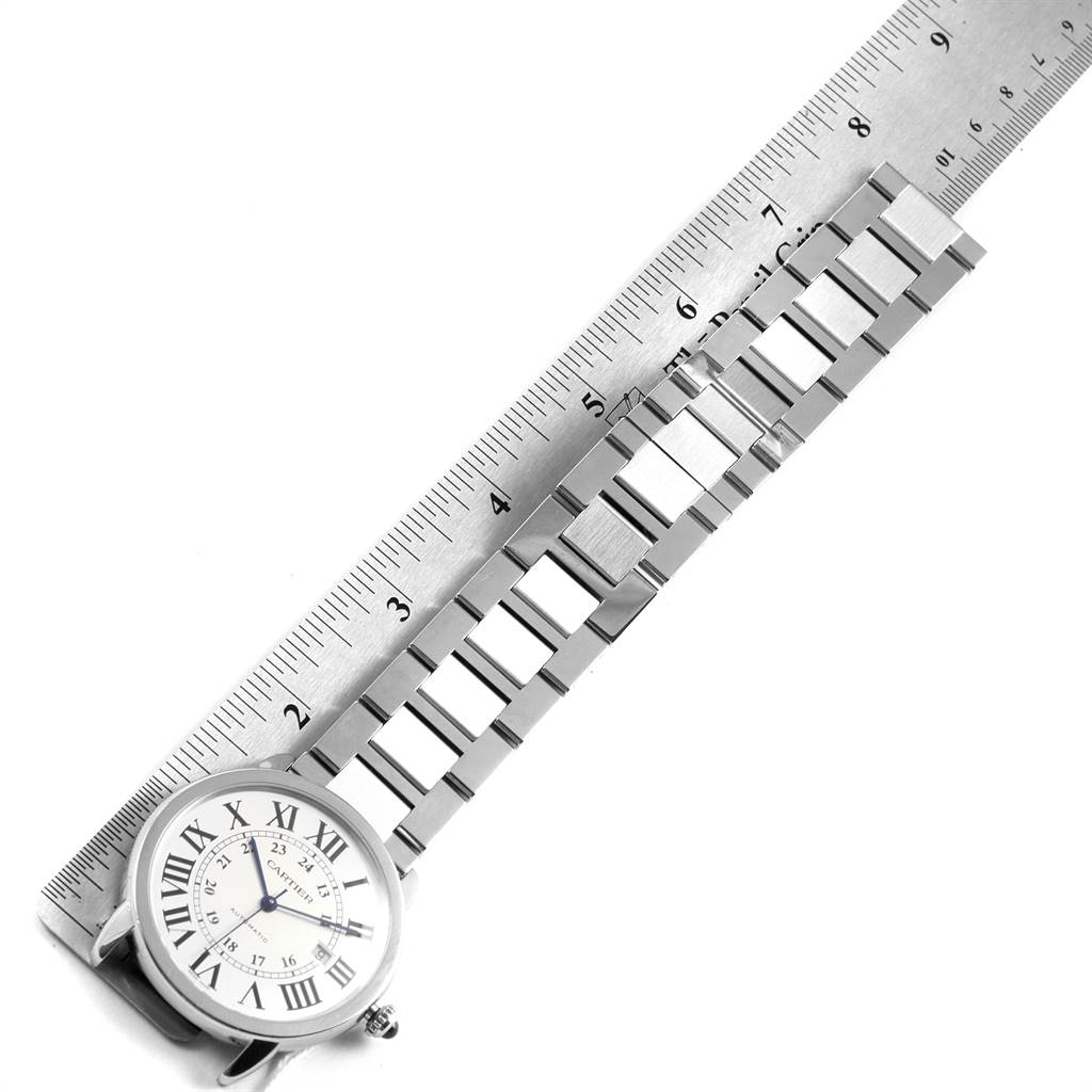 The image shows the face and metal bracelet of a Cartier Ronde W6701011 Men's Stainless Steel Silver Dial W6701011 Men's Stainless Steel Silver Dial model watch from a top-down angle with a ruler for scale.