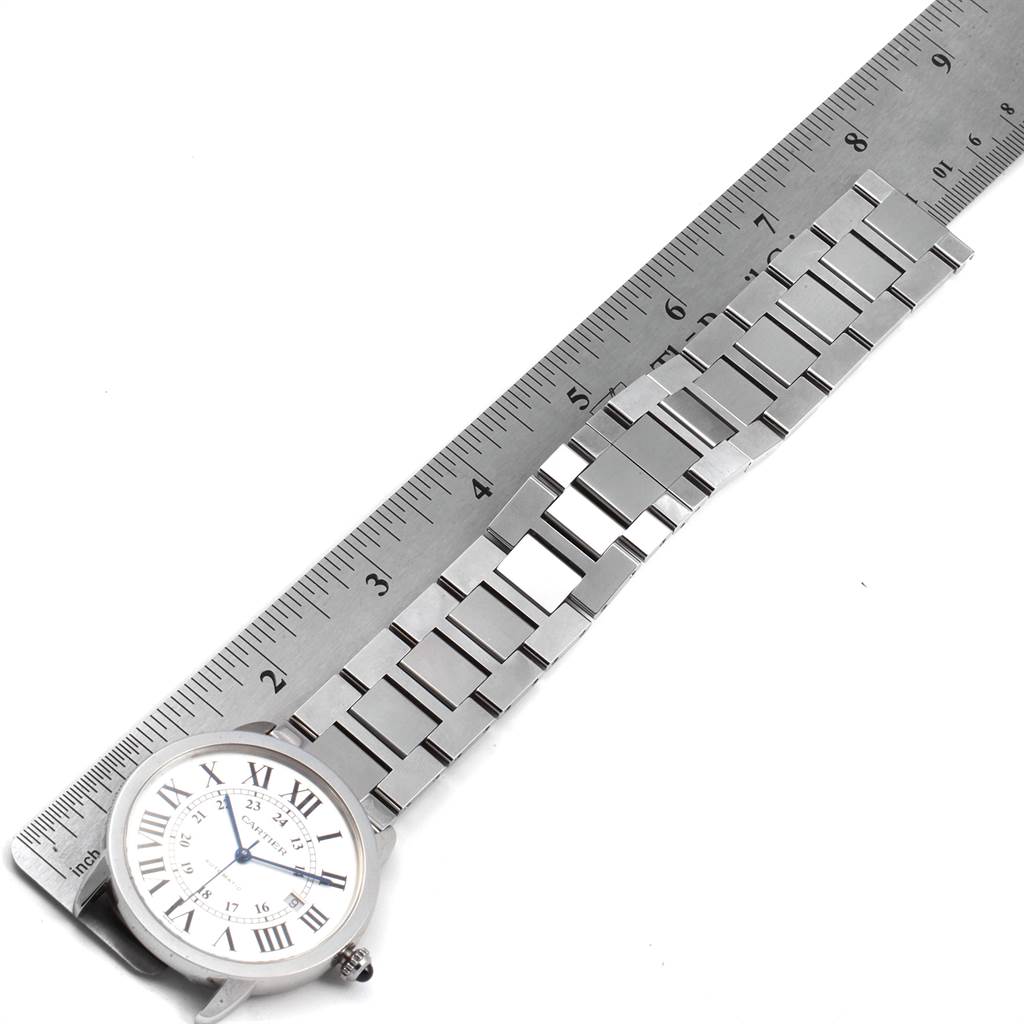 The image shows the Cartier Ronde W6701011 Men's Stainless Steel Silver Dial W6701011 Men's Stainless Steel Silver Dial watch face and metal bracelet, aligned with a ruler for measurement.