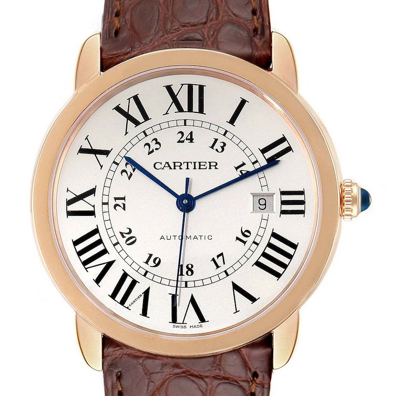 The image shows a front view of the Cartier Ronde watch, showcasing its dial, Roman numerals, and brown leather strap.