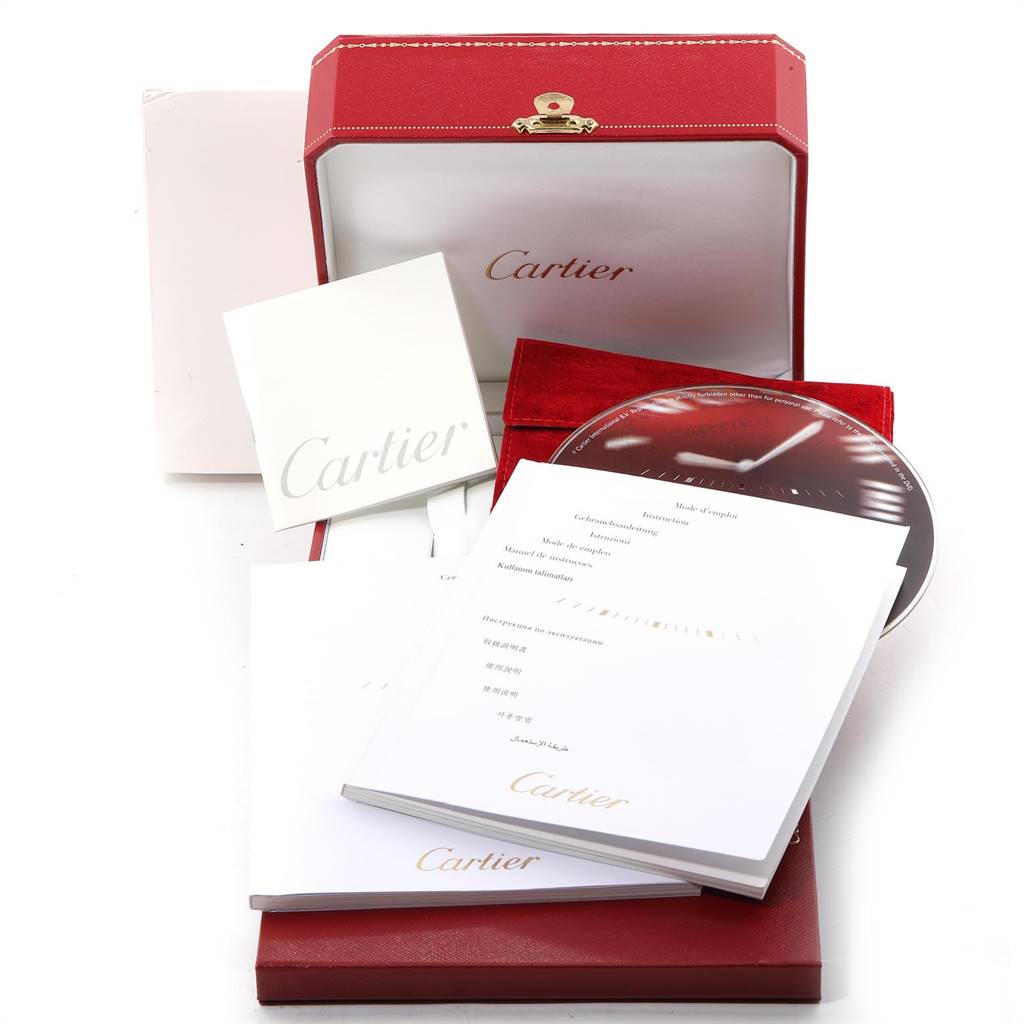 This image shows the packaging, manuals, and accessories for a Cartier Ronde W6701011 Men
s Stainless Steel Silver Dial W6701011 Men
s Stainless Steel Silver Dial model watch, displayed from a front angle.