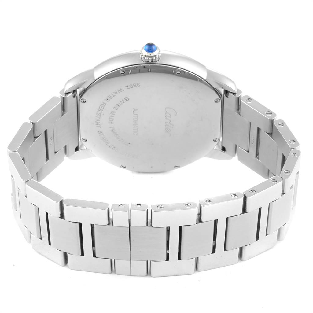 This image shows the back side of the Ronde model by Cartier, highlighting its stainless steel bracelet and blue cabochon crown.