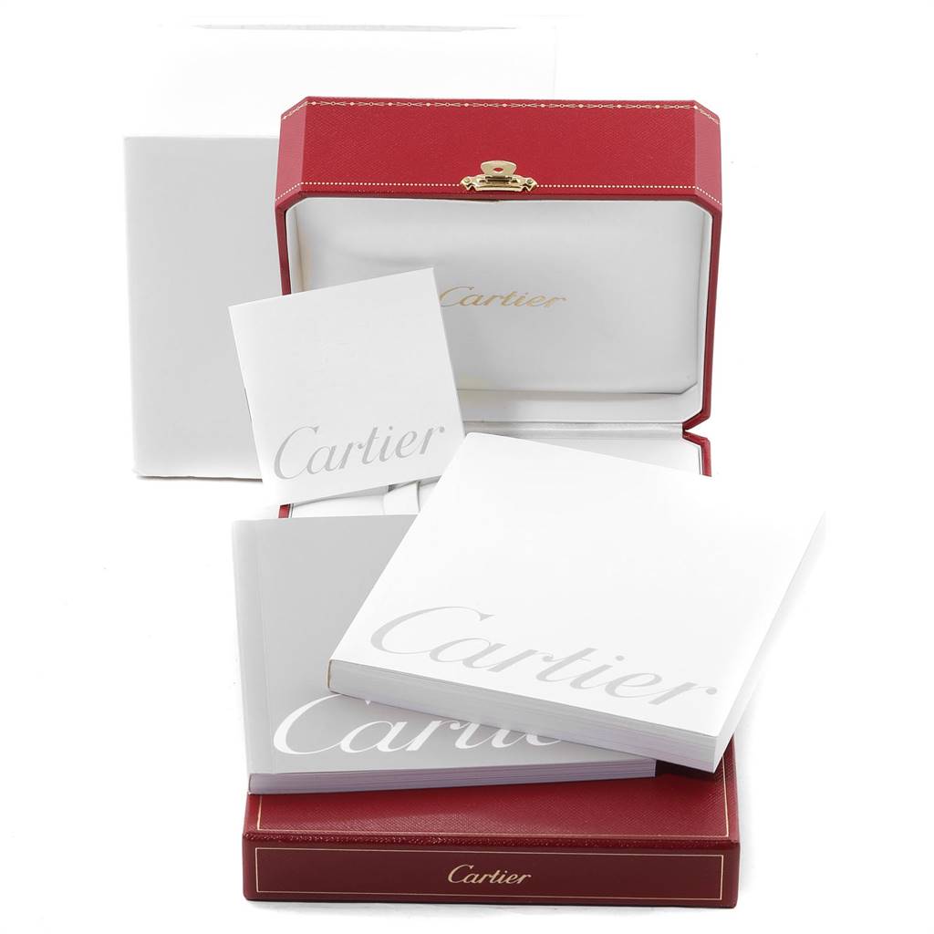 This image shows the packaging and documentation for the Ronde model by Cartier, including a red box and white booklets.
