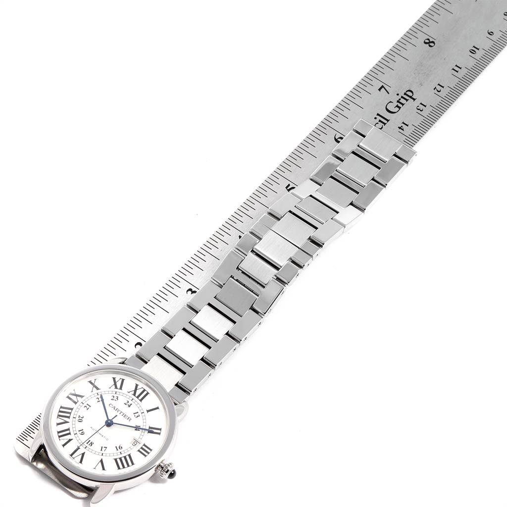 The image shows a Cartier Ronde W6701011 Men's Stainless Steel Silver Dial W6701011 Men's Stainless Steel Silver Dial watch laid flat with its bracelet extended beside a ruler.