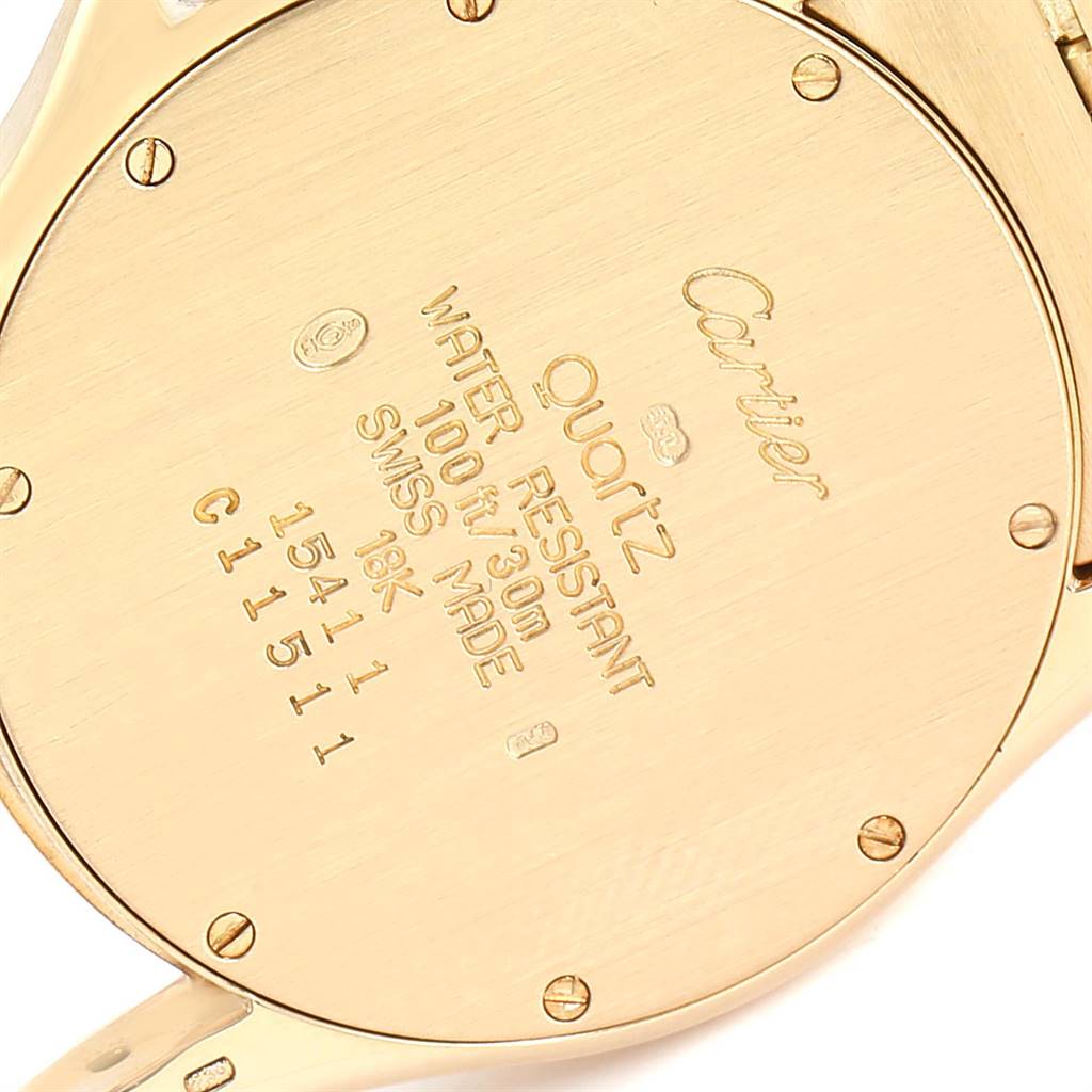 The image shows the back case of a Cartier Santos W20028G1 Women
s Steel and Gold (two tone) Silver Dial W20028G1 Women
s Steel and Gold (two tone) Silver Dial watch, highlighting its inscriptions and screw details.