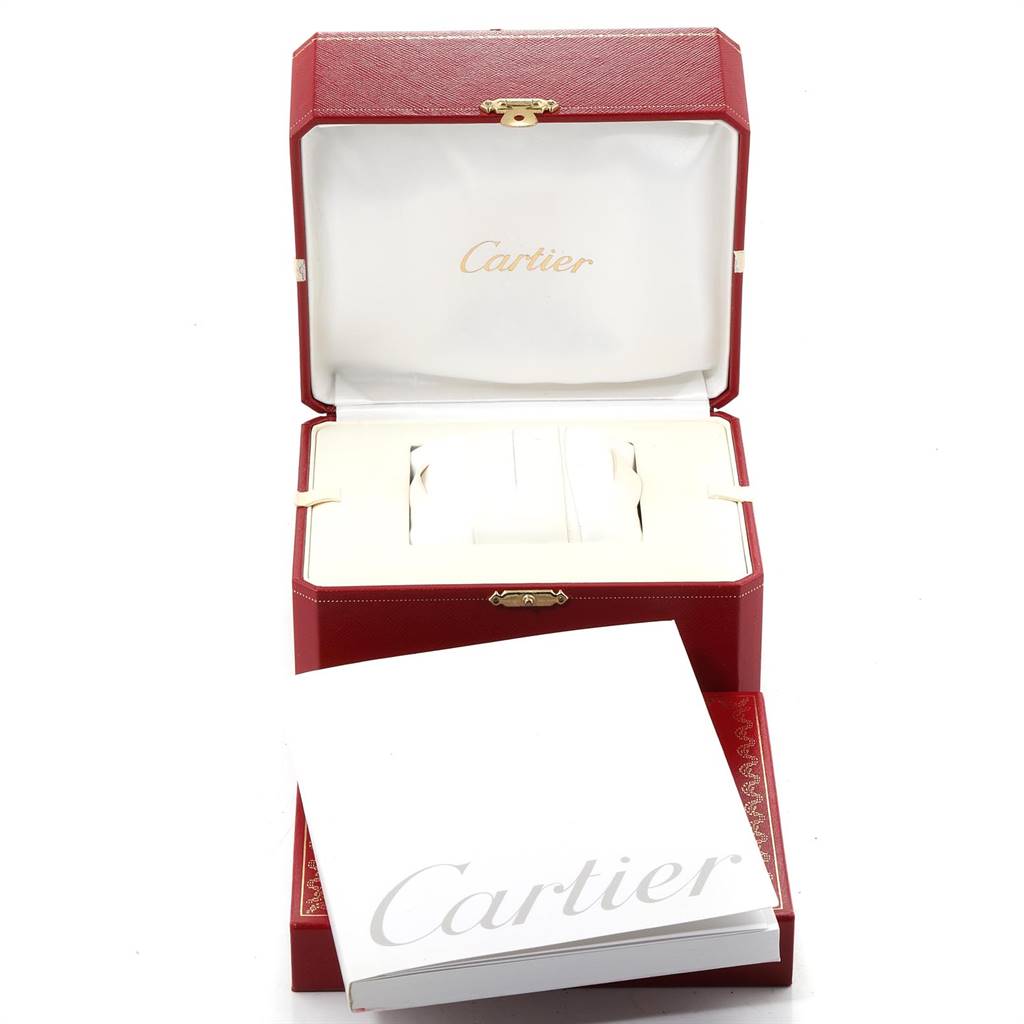 The image shows an open Cartier Santos W20028G1 Women
s Steel and Gold (two tone) Silver Dial W20028G1 Women
s Steel and Gold (two tone) Silver Dial watch box with a Cartier booklet in front.
