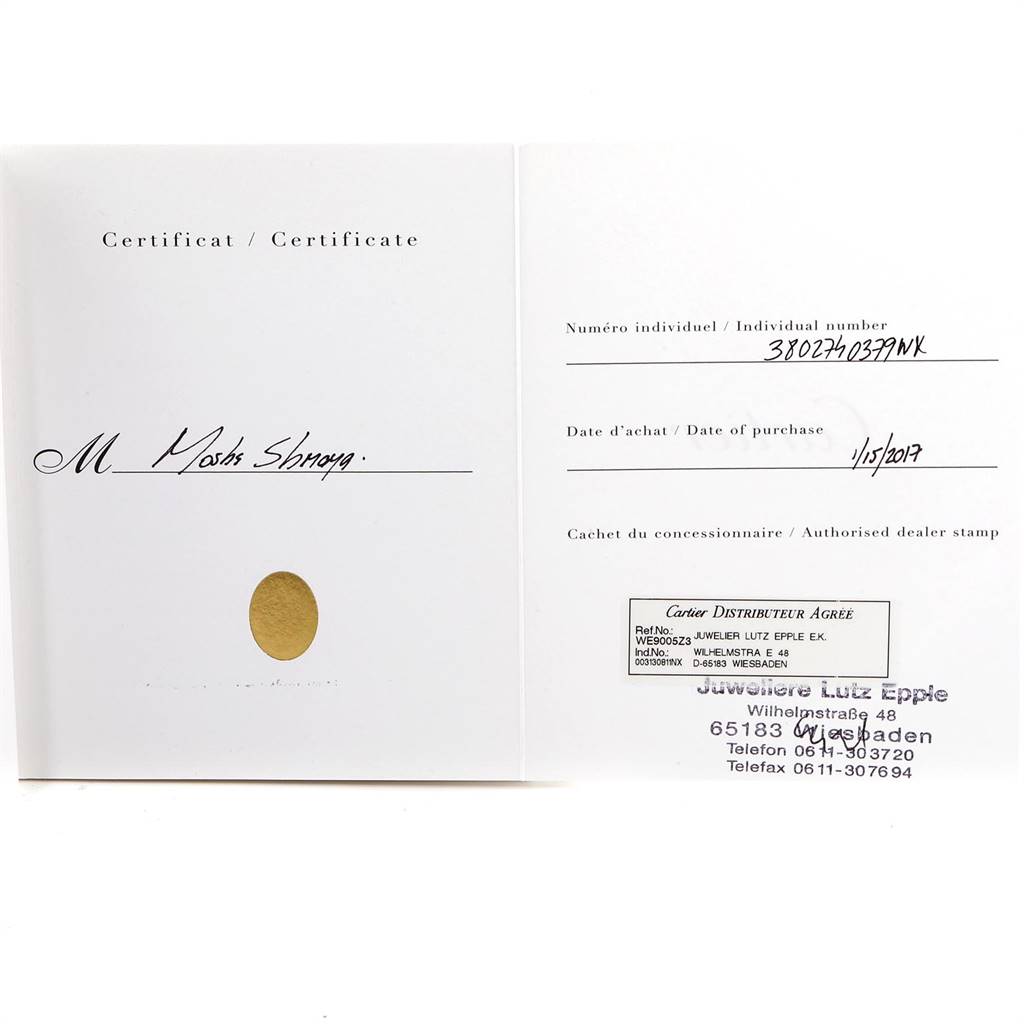 This image shows a certificate for a Cartier Ronde W6701011 Men
s Stainless Steel Silver Dial W6701011 Men
s Stainless Steel Silver Dial watch, displaying purchase details and an authorized dealer stamp.