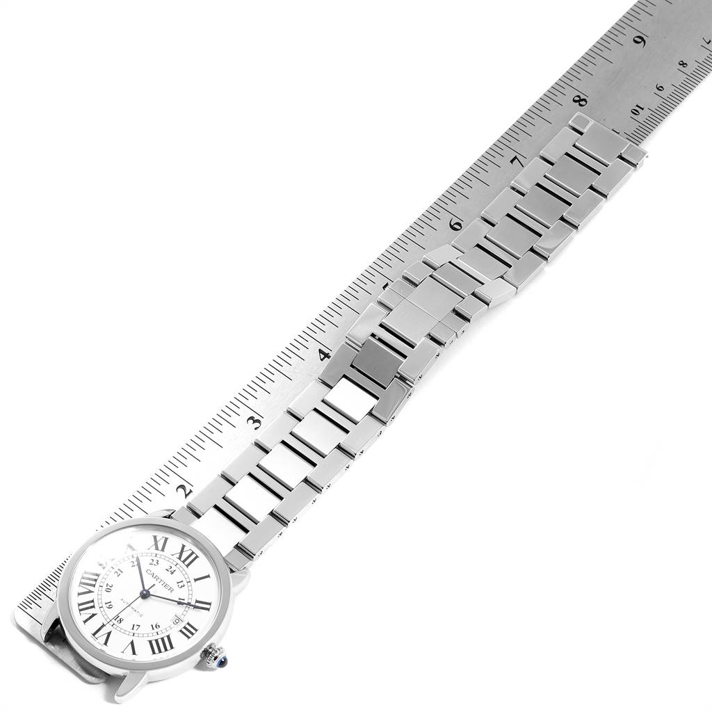 The image shows a Cartier Ronde W6701011 Men's Stainless Steel Silver Dial W6701011 Men's Stainless Steel Silver Dial watch at an angle displaying the dial and the metal bracelet measured against a ruler.