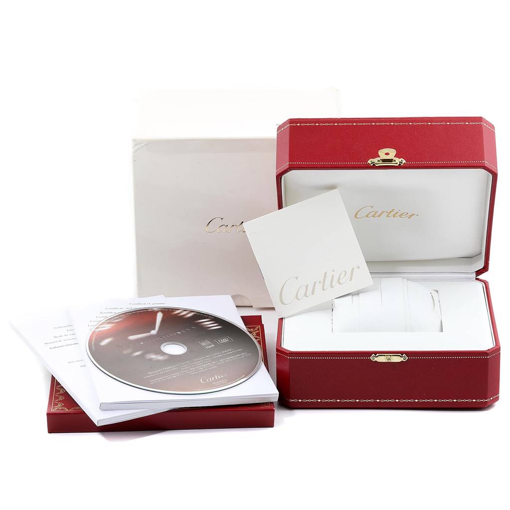 The image shows the accessories of the Ronde model by Cartier, including the box, booklet, and a disc.